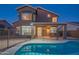 Two-story home with fenced pool, patio, and grassy yard at 7415 W Via De Luna Dr, Glendale, AZ 85310