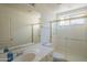 Bathroom with a single sink vanity, toilet, and glass shower at 7415 W Via De Luna Dr, Glendale, AZ 85310