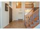 Inviting home foyer featuring a soaring staircase and neutral decor at 7415 W Via De Luna Dr, Glendale, AZ 85310