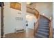 Inviting home foyer featuring a soaring staircase and neutral decor at 7415 W Via De Luna Dr, Glendale, AZ 85310