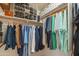 Organized walk-in closet featuring clothing racks, shelving for shoes, and ample storage space at 7415 W Via De Luna Dr, Glendale, AZ 85310