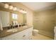 Elegant bathroom with double vanity, granite countertops, and a glass-enclosed shower at 8740 E Mulberry St, Scottsdale, AZ 85251
