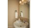This cozy powder room features tile flooring, stylish fixtures, and an elegant sink basin at 8740 E Mulberry St, Scottsdale, AZ 85251