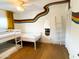This bedroom features colorful custom paint details, hardwood floors, a ceiling fan, and a bunkbed at 8740 E Mulberry St, Scottsdale, AZ 85251
