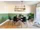 Stylish dining room featuring modern lighting fixture and a trendy green and white color scheme at 8740 E Mulberry St, Scottsdale, AZ 85251