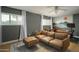This stylish living room has hardwood floors, ample natural light, and a decorative accent wall at 8740 E Mulberry St, Scottsdale, AZ 85251