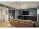 This stylish living room features hardwood floors, modern track lighting, and custom built-in cabinets at 8740 E Mulberry St, Scottsdale, AZ 85251