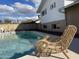 Enjoy your own backyard oasis with a relaxing pool, and wicker chair, creating the perfect outdoor escape at 8740 E Mulberry St, Scottsdale, AZ 85251