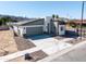 An elevated view of a single-story home with desert landscaping, a two-car garage, and mountain views at 909 E Desert Ln, Phoenix, AZ 85042
