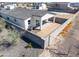 Aerial view of a backyard with a covered patio and block wall providing privacy at 909 E Desert Ln, Phoenix, AZ 85042