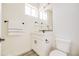 Clean modern bathroom with white vanity and sleek black fixtures at 909 E Desert Ln, Phoenix, AZ 85042