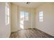 Well-lit bedroom with neutral walls and multiple windows at 909 E Desert Ln, Phoenix, AZ 85042