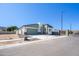 Street view of a modern home with xeriscaping, a garage, and mountain views at 909 E Desert Ln, Phoenix, AZ 85042