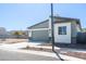 Front view of a home with a two-car garage, landscaped yard, and desert view at 909 E Desert Ln, Phoenix, AZ 85042