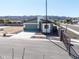 New single-story home with a gated entry and a two-car garage at 909 E Desert Ln, Phoenix, AZ 85042