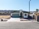 Charming single-story home with a modern garage and a desert-landscaped yard at 909 E Desert Ln, Phoenix, AZ 85042