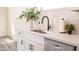 Modern kitchen with white cabinetry, subway tile backsplash, and stainless steel appliances at 909 E Desert Ln, Phoenix, AZ 85042