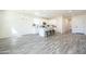Bright open concept living and kitchen area with modern finishes and neutral flooring at 909 E Desert Ln, Phoenix, AZ 85042