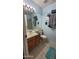 Well-maintained bathroom with a large mirror, a wooden vanity, and a shower with a glass door at 921 W University Dr # 1101, Mesa, AZ 85201