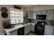 Well-lit kitchen features updated appliances, gray cabinets and a stylish backsplash for a modern look at 921 W University Dr # 1101, Mesa, AZ 85201