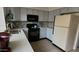 Bright kitchen with updated appliances, gray cabinets and tiled flooring at 921 W University Dr # 1101, Mesa, AZ 85201