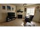 Cozy living room featuring a fireplace, comfortable seating, and stylish tropical themed decor at 921 W University Dr # 1101, Mesa, AZ 85201