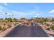 Aerial view of the neighborhood entry, showcasing well-maintained landscaping and common areas at 10914 E Navajo Dr, Sun Lakes, AZ 85248