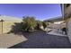Spacious backyard featuring a covered patio and well-maintained landscaping, perfect for outdoor entertaining at 11408 E Natal Ave, Mesa, AZ 85209