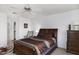 Comfortable bedroom with a classic dark wood sleigh bed and coordinated furnishings, inviting retreat at 11408 E Natal Ave, Mesa, AZ 85209