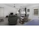 Comfortable living room with neutral paint, a ceiling fan, and a view of the backyard at 11408 E Natal Ave, Mesa, AZ 85209