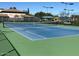 The outdoor tennis court is well maintained and ready for a match at 11408 E Natal Ave, Mesa, AZ 85209