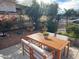 Charming backyard patio featuring a wooden table with comfortable seating, ideal for outdoor dining and relaxation at 15650 N 19Th Ave # 1189, Phoenix, AZ 85023