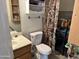 Cozy bathroom features functional layout with a standard toilet, vanity, and shower-tub combo at 15650 N 19Th Ave # 1189, Phoenix, AZ 85023