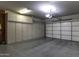 Spacious garage with ample storage cabinets and a clean, well-lit environment at 1587 E Brenda Dr, Casa Grande, AZ 85122