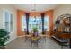 Cozy breakfast nook with large windows, a decorative light fixture, and stylish furnishings at 16935 W Desert Blossom Way, Surprise, AZ 85387