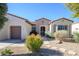 Attractive single-Gathering home with a well-manicured front yard, desert landscaping, and a welcoming entrance at 16935 W Desert Blossom Way, Surprise, AZ 85387