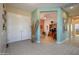 Inviting foyer with tiled flooring, a decorative vase, and an open view into the office at 16935 W Desert Blossom Way, Surprise, AZ 85387
