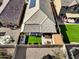 Aerial view of a home's backyard featuring a jacuzzi, manicured lawn, and a covered patio at 17193 N Rosemont St, Maricopa, AZ 85138