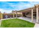 Secluded backyard features a grill, patio seating, and a well-maintained grassy area at 17193 N Rosemont St, Maricopa, AZ 85138