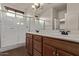 Bright bathroom with double sinks and a large shower at 17193 N Rosemont St, Maricopa, AZ 85138