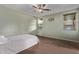Cozy bedroom with neutral color scheme and ceiling fan at 17193 N Rosemont St, Maricopa, AZ 85138
