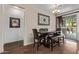 Casual dining area with a dark wood table and plenty of room to host at 17193 N Rosemont St, Maricopa, AZ 85138