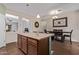 Open concept kitchen with island and eat in dining at 17193 N Rosemont St, Maricopa, AZ 85138
