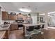 Spacious kitchen with stainless steel appliances, kitchen island, and a breakfast bar at 17193 N Rosemont St, Maricopa, AZ 85138