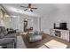 Open living room with neutral color scheme, carpet flooring and backyard views at 17193 N Rosemont St, Maricopa, AZ 85138