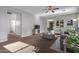 Cozy living room with carpet flooring, ceiling fan, and neutral paint colors at 17193 N Rosemont St, Maricopa, AZ 85138