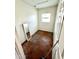 A tiled room featuring a wall mirror at 17224 N 56Th Dr, Glendale, AZ 85308