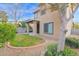 A landscaped backyard features a manicured lawn with desert landscaping at 18234 N Alicia Ct, Maricopa, AZ 85138