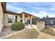 Inviting backyard features a covered patio, built-in BBQ, and privacy wall, perfect for outdoor entertaining at 18298 N Kari Ln, Maricopa, AZ 85139