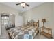 Bedroom with a ceiling fan, carpeting and sliding mirror closet doors at 18298 N Kari Ln, Maricopa, AZ 85139